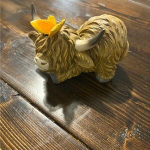 Whimsical Cow Figurine with Butterfly Accent